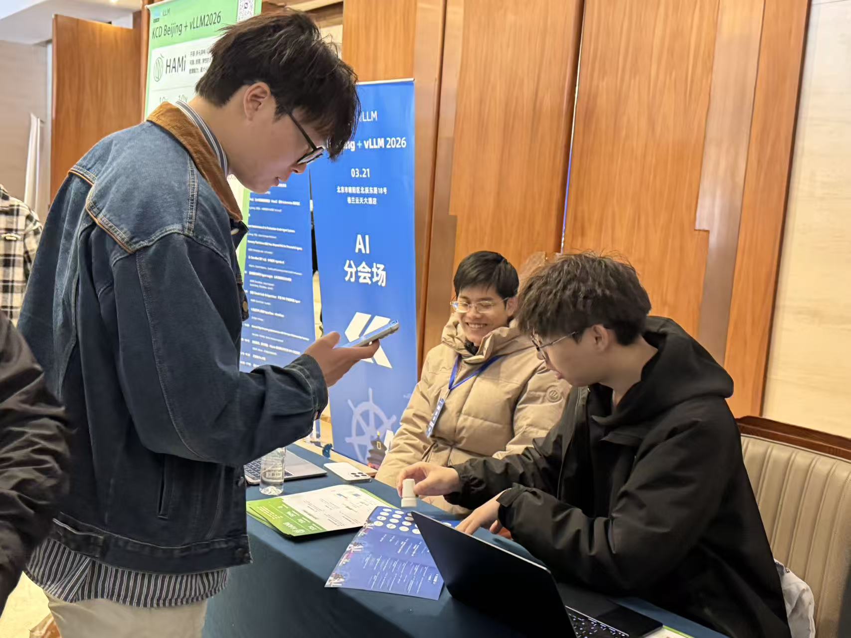 Volunteers stamping for attendees